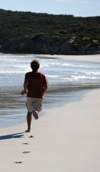 Running man at the beach